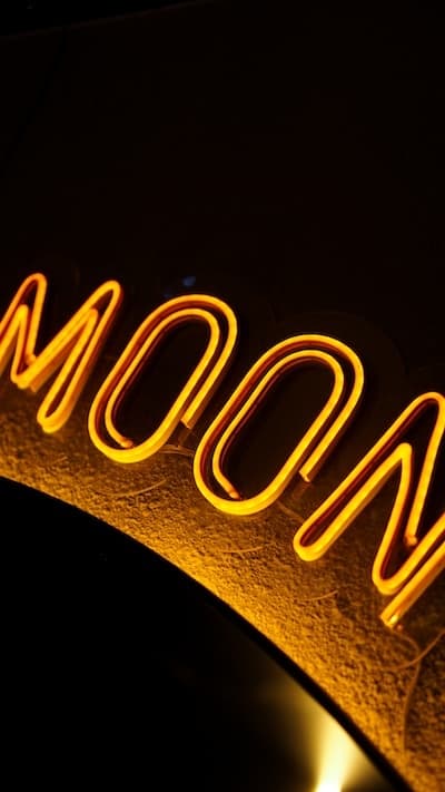 The glowing MOON neon sign
