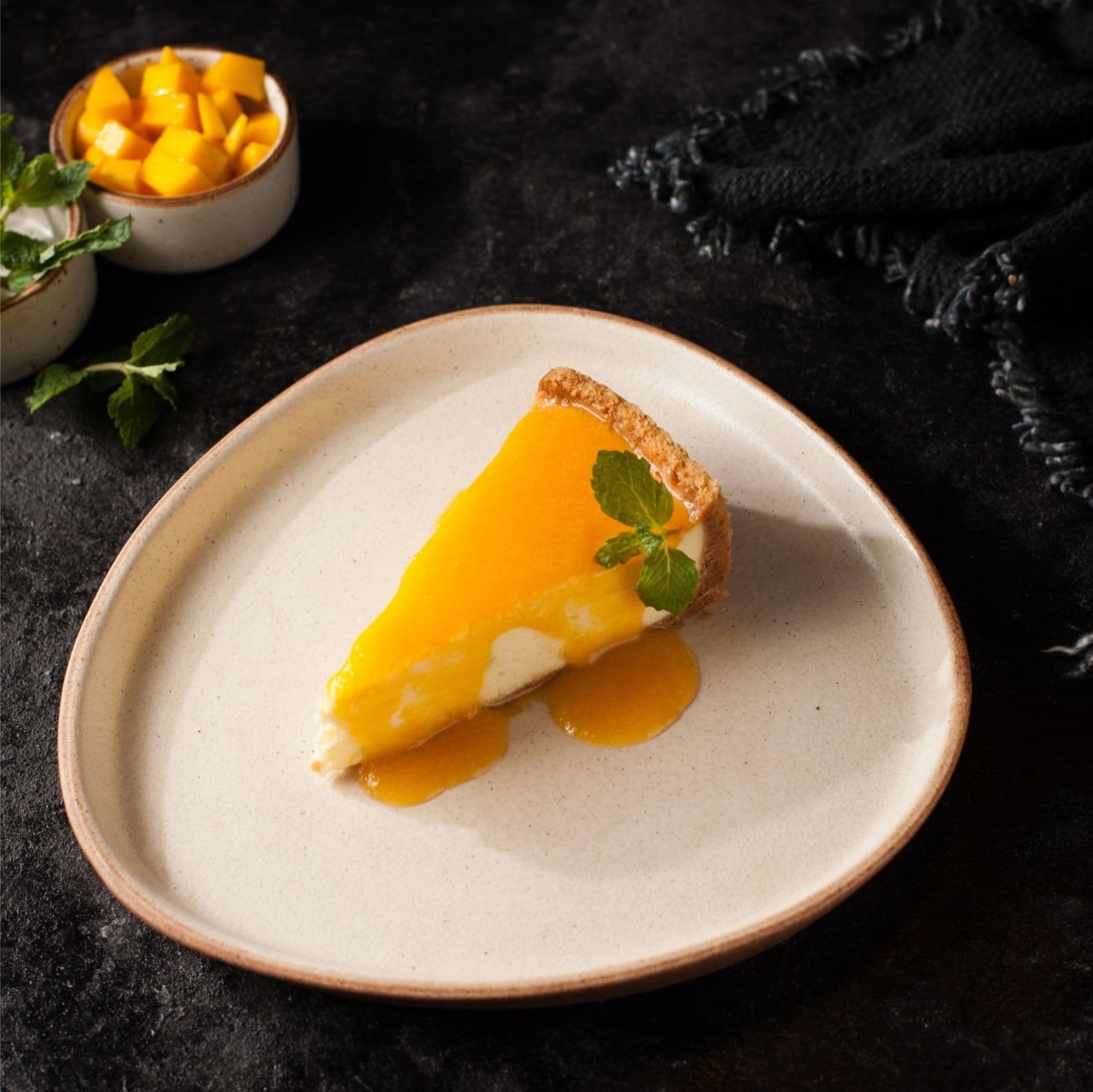 CHEESECAKE WITH PINEAPPLE-PASSION FRUIT SAUCE